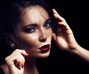 Image showing beauty brunette woman under black veil with red manicure close u