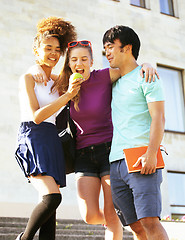 Image showing cute group of teenages at the building of university with books huggings, back to school