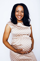 Image showing young pretty african american woman pregnant happy smiling, posing on white background isolated , lifestyle people concept