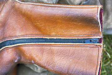 Image showing Brown leather shoe, closeup metal zipper