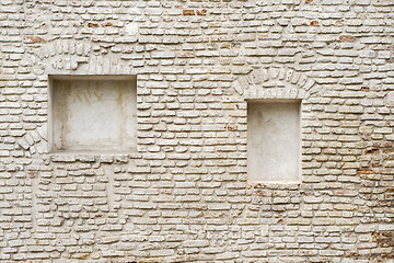 Image showing abandoned cracked brick stucco wall with a stucco frame