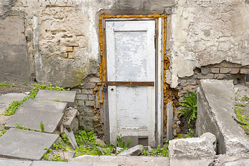 Image showing wooden plank door, dirty grunge brick wall