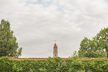 Image showing church tower behind the red wall