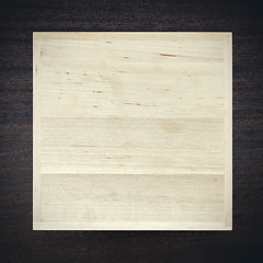 Image showing White wooden box on dark background