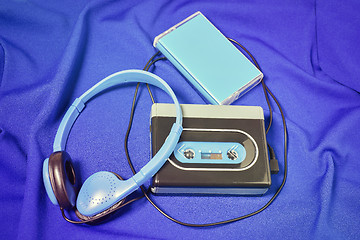 Image showing Retro cassette walkman on the blue fabric background