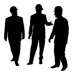 Image showing Three businessmen architects engineers or workers with protectiv