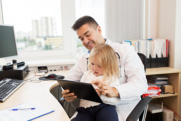 Image showing doctor or pediatrician with girl patient at clinic