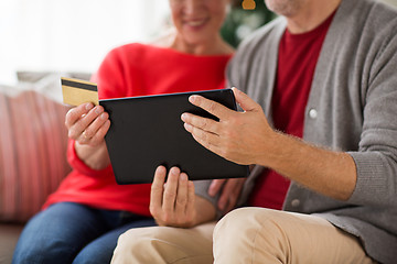 Image showing senior couple with tablet pc shopping online