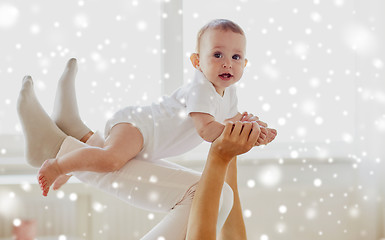 Image showing happy mother playing with baby at home