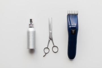 Image showing styling hair spray, trimmer and scissors