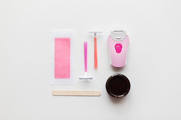 Image showing hair removal wax, epilator and safety razor