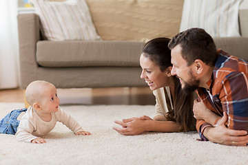 Image showing happy family playing with baby at home