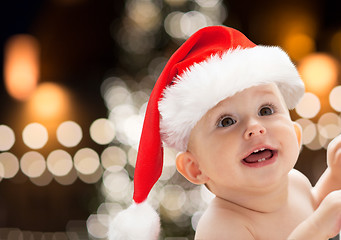 Image showing close up of little baby in santa hat at christmas