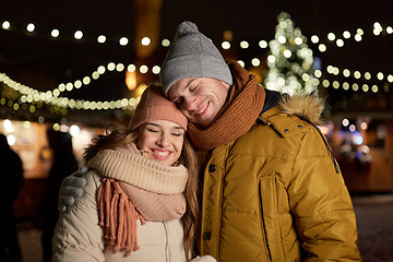 Image showing happy couple hugging at christmas tree