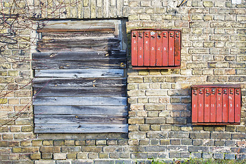 Image showing Rusty mailboxes on the brick grunge wall