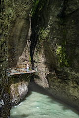 Image showing A traveler shooting amazing landscape of mountain river 