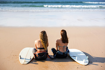 Image showing Surfer girls at the beach 