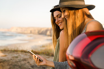 Image showing Girl showing something on the phone