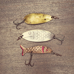 Image showing Retro rusty lures on the wooden background