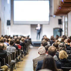 Image showing Business speaker giving a talk at business conference event.