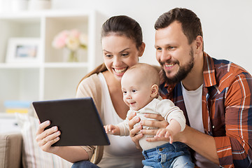 Image showing mother, father and baby with tablet pc at home