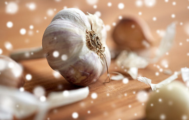 Image showing close up of garlic on wooden table