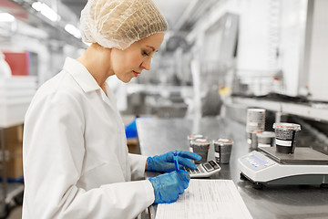 Image showing woman working at ice cream factory