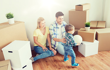 Image showing happy family moving to new home and playing ball