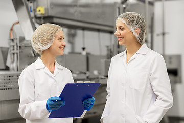 Image showing happy women technologists at ice cream factory