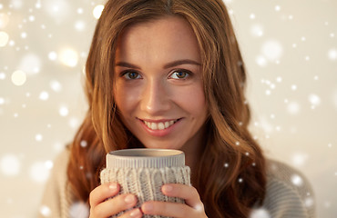 Image showing close up of woman with tea or coffee cup at home