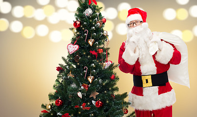 Image showing santa claus with bag and christmas tree