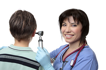 Image showing Doctor checking ears with otoscope