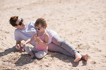 Image showing Mom and daughter on the beach