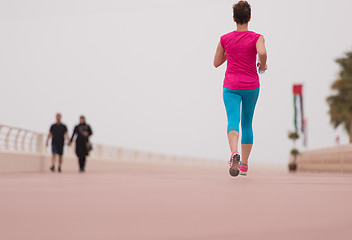 Image showing woman busy running on the promenade