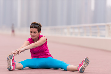 Image showing woman stretching and warming up