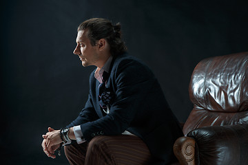 Image showing Businessman sitting on an armchair