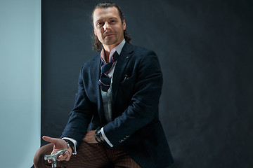 Image showing Businessman sitting on an armchair