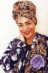 Image showing beauty bright african woman with creative make up, shawl on head like cubian closeup smiling, cheerful tan mulatto, lifestyle people concept