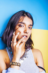 Image showing lifestyle people concept. young pretty smiling indian girl with long nails wearing lot of jewelry rings, asian summer happy cool