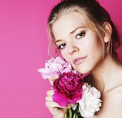 Image showing young beauty woman with flower peony pink closeup makeup soft te