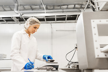 Image showing woman working at ice cream factory