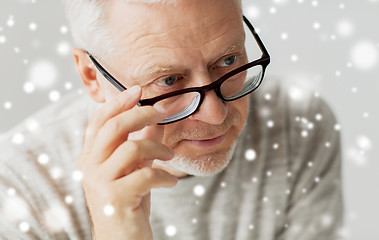 Image showing close up of senior man in glasses thinking