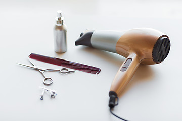 Image showing hairdryer, scissors, comb and styling hair spray