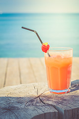 Image showing Orange cocktail on the wooden table