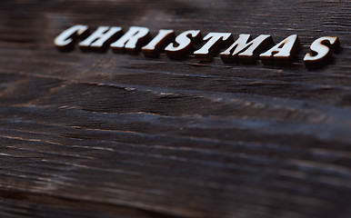 Image showing Christmas text on a wooden wall