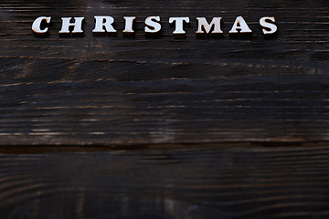 Image showing Christmas text on a wooden wall