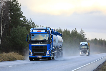 Image showing Volvo FH Trucks on Wet Highway