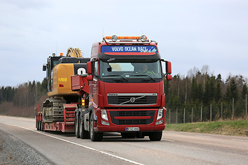 Image showing Red Volvo FH Transports Heavy Machinery