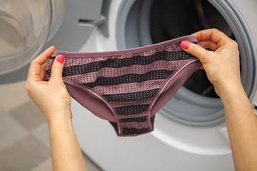 Image showing woman holding panties 