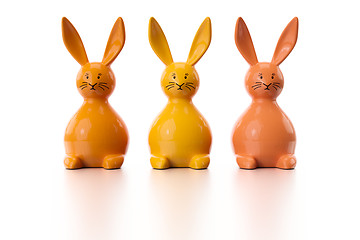 Image showing three orange easter bunny figures